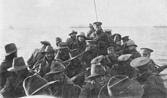 Lifeboat carrying men of the Australian 1st Divisional Signal Company as they are towed towards Anzac Cove on the day of the landing. Picture by the Australian War Memorial.