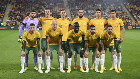 The Socceroos pose for a photo before the start of a friendly soccer international between Australia and New Zealand in Brisbane in September 2022. Picture by AP Photo/Dan Peled