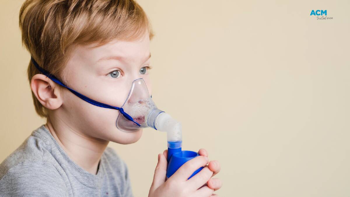 A child uses an asthma inhaler. File picture. 