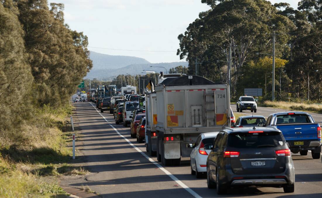 Southbound school holiday traffic banked up on the Pacific Highway between Hexham and Heatherbrae. Picture by Max Mason-Hubers