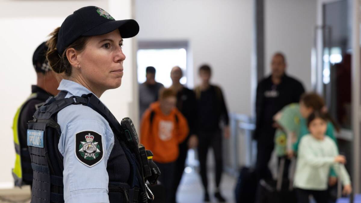Australian Federal Police officers patrol the country's airports. Picture AFP Australian Federal Police officers patrol the country's airports. Picture AFP