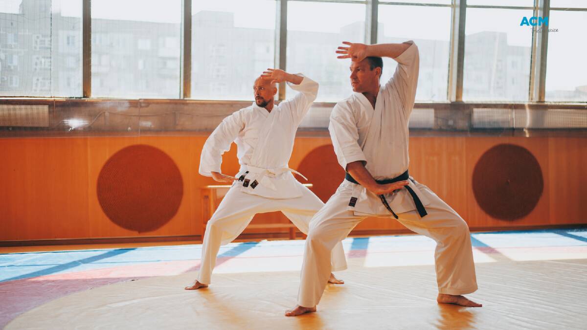 Two men practise karate, Australia's 77th favourite passion. Picture via Canva