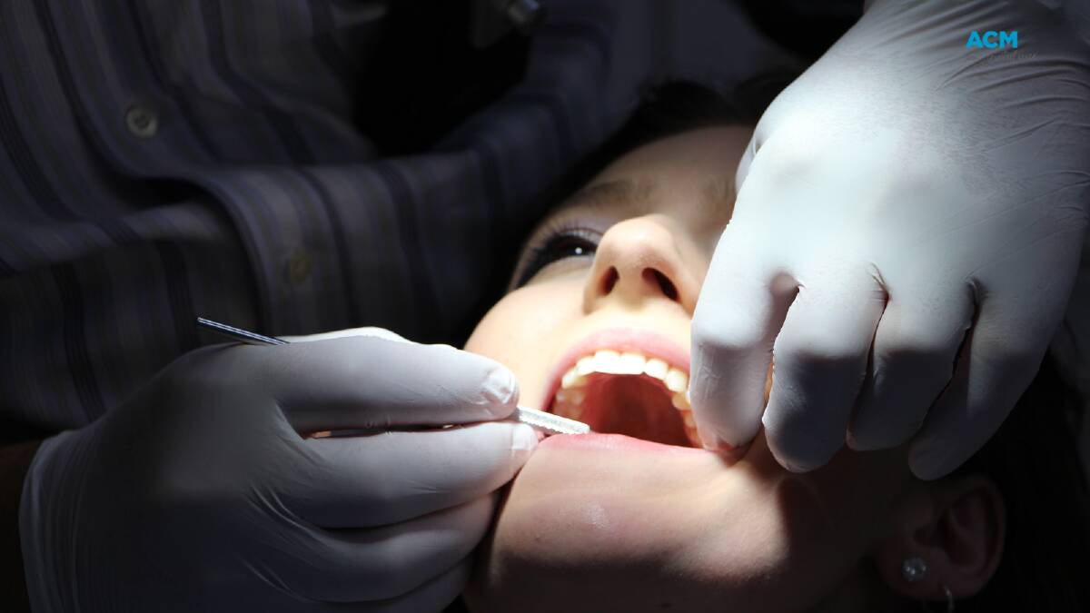 A patient receiving an oral examination. File picture.