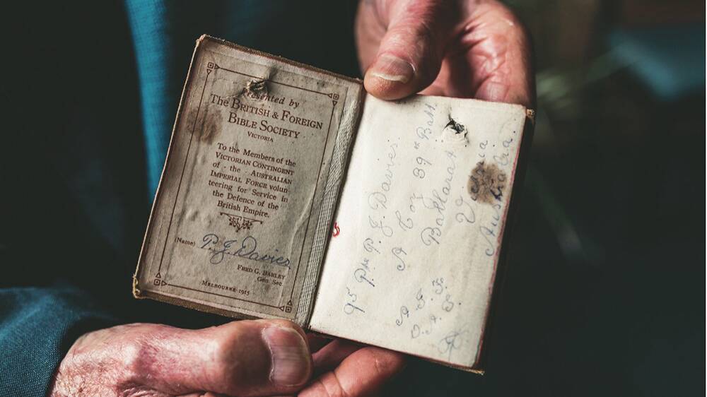 A soldier's bible belonging to Philip J. Davies with a piece of shrapnel through the pages. Picture via Eternity News