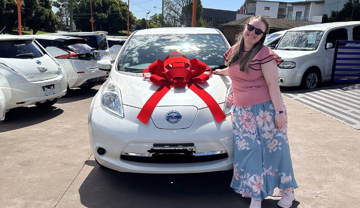 Abbey Sim bought her first electric car in a bid to better care for the environment. She now carefully plans her road trips. Picture supplied. 