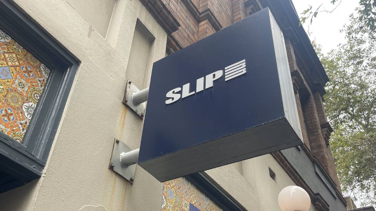 The sign outside the Slip Inn where Danish King Frederik and Queen Consort Mary met in 2000. Picture by Brianna Hedges