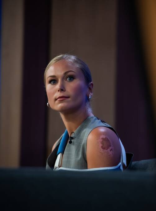 Grace Tame appearing at the National Press Club with a broken collarbone after a cycling accident in 2022. Picture by Karleen Minney