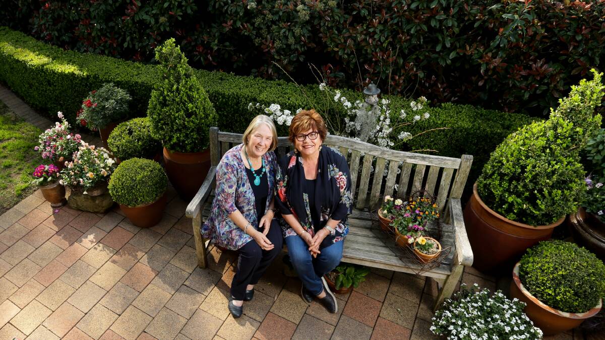 SPROUT: Black and White committee president Heather McLaren with Metford resident Switlana Hedges in her garden, which is one of eight exhibiting for the Maitland Garden Ramble on the weekend. Picture: Jonathan Carroll 