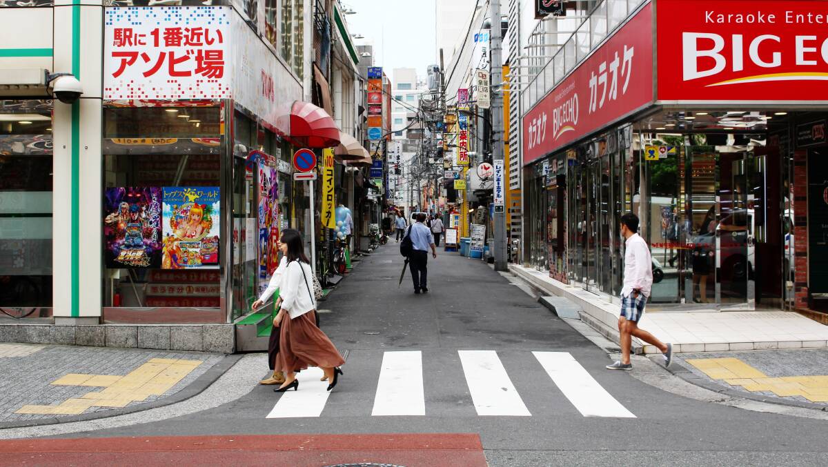 A pachinko parlor and karaoke centre on the corners in central Tokyo. Picture Shutterstock