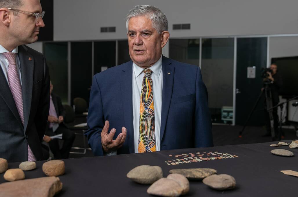Indigenous Australians Minister Ken Wyatt looks at stone items returned by the Israel Museum to Indigenous communities. Picture: Keegan Carroll