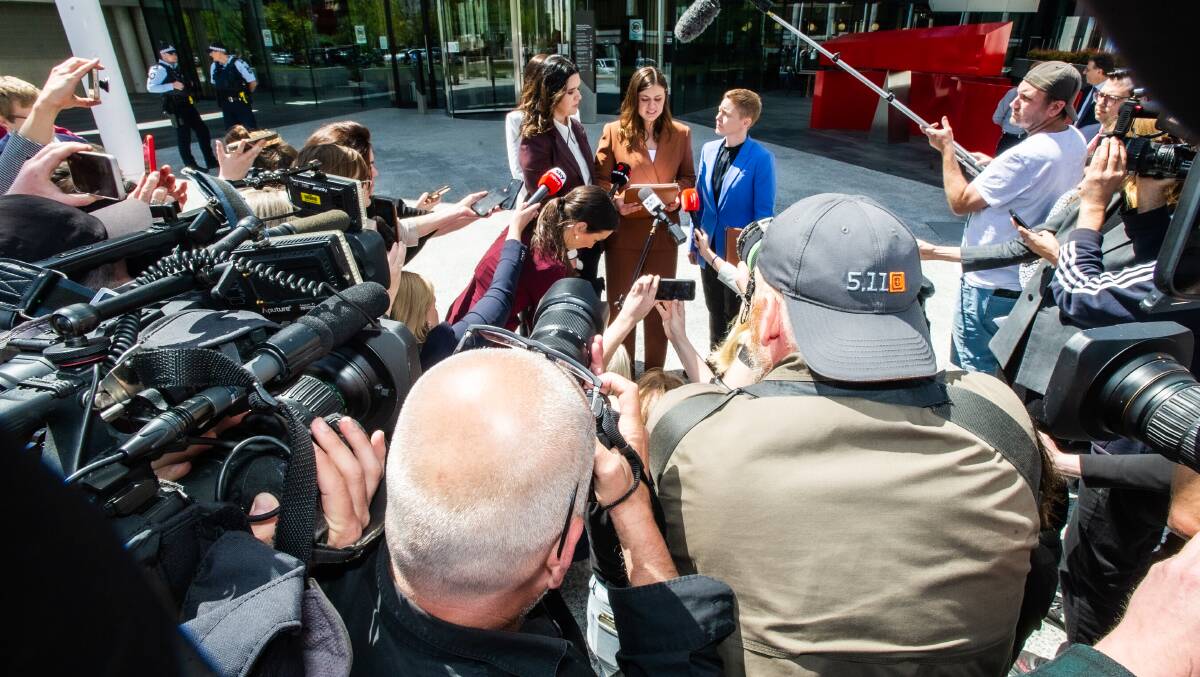 Brittany Higgins faces a large contingent of news cameras outside court. Picture by Karleen Minney
