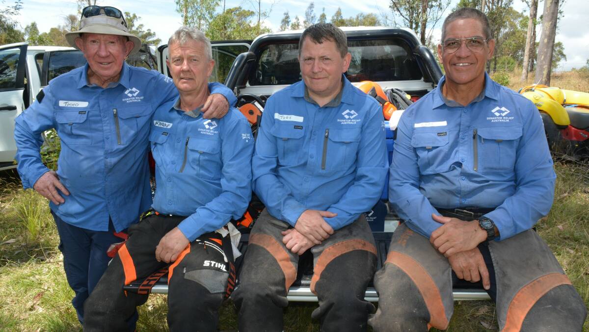 Disaster Relief Australia volunteers on the job at Quaama on February 28 (from left) Timmo, Frode, Tore and Chief. Picture by Ben Smyth