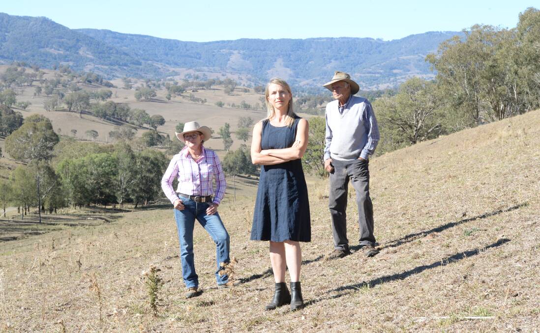 Vicki Dempsey, Hills of Gold Preservation Inc member Megan Trousdale and Ian Worley Snr stand at the headwaters of three river systems. None want a wind farm on the hills.