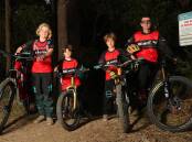 Bike and Fitness head coach Damien Enderby with brothers Seth, 11, Finn, 5, and Lennox Parsons, 7. Picture by Peter Lorimer 