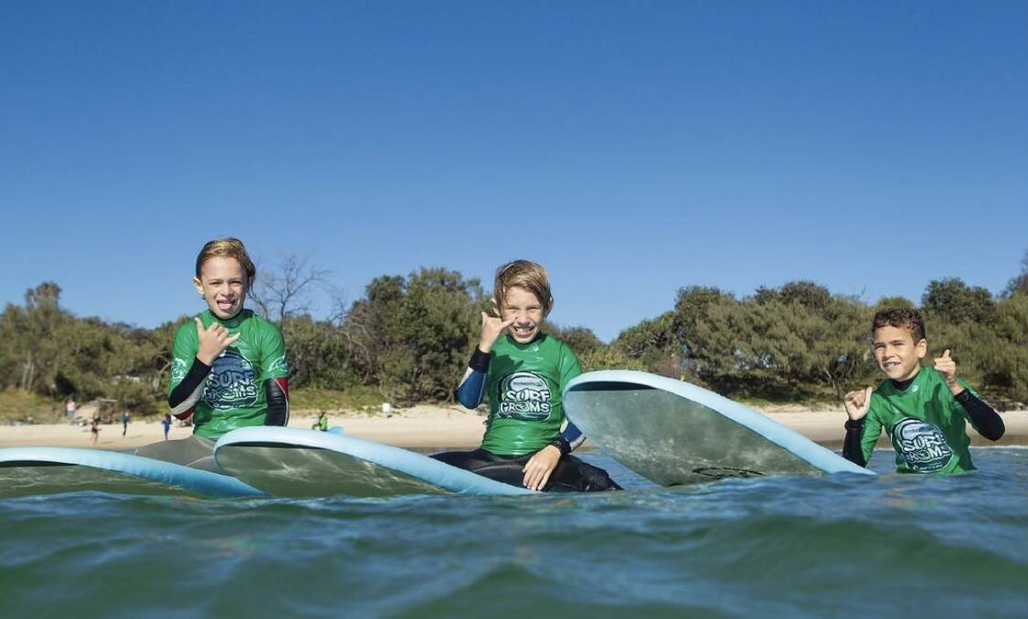 Kids in the Learn to Surf Newcastle program, which benefited from the Active Kids vouchers. Picture supplied 