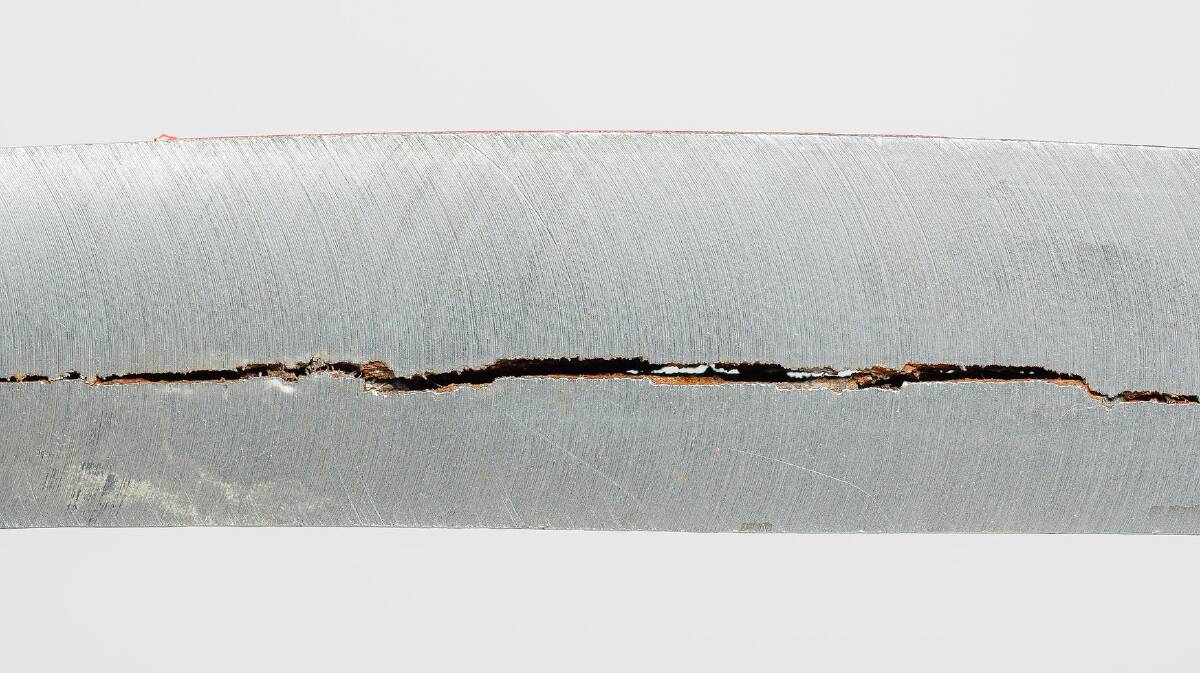 WE HAVE A PROBLEM, HOUSTON: A hydrogen-induced crack in a steel pipe. Hydrogen not only 'embrittles' steel, its molecules, the smallest in existence, can actually pass right through steel. Picture: CEphoto, Uwe Aranas
