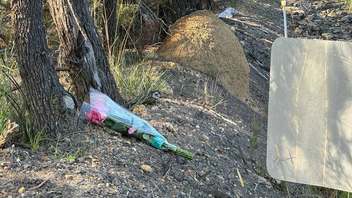 Flowers left at the scene, on Wednesday morning. Picture by Karleen Minney