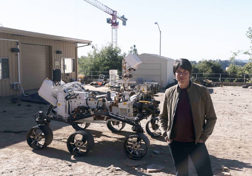 ABOVE: Brian Cox with a duplicate of the Mars rover, which makes him more excited than he looks in this photo. BELOW: Shane and daughter Kayla appear in the WIN series My Mum Your Dad.
