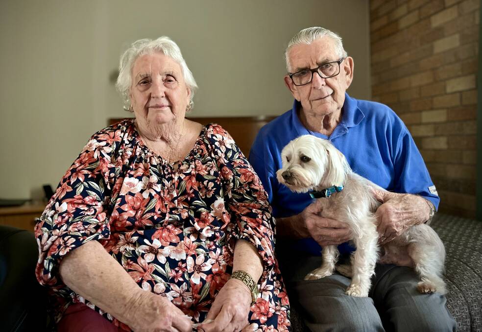 Lorna and Colin Shapland with their dog Fluffy in a hotel in Mudgee on March 15 after their Hill End home was burned down. Picture by Benjamin Palmer