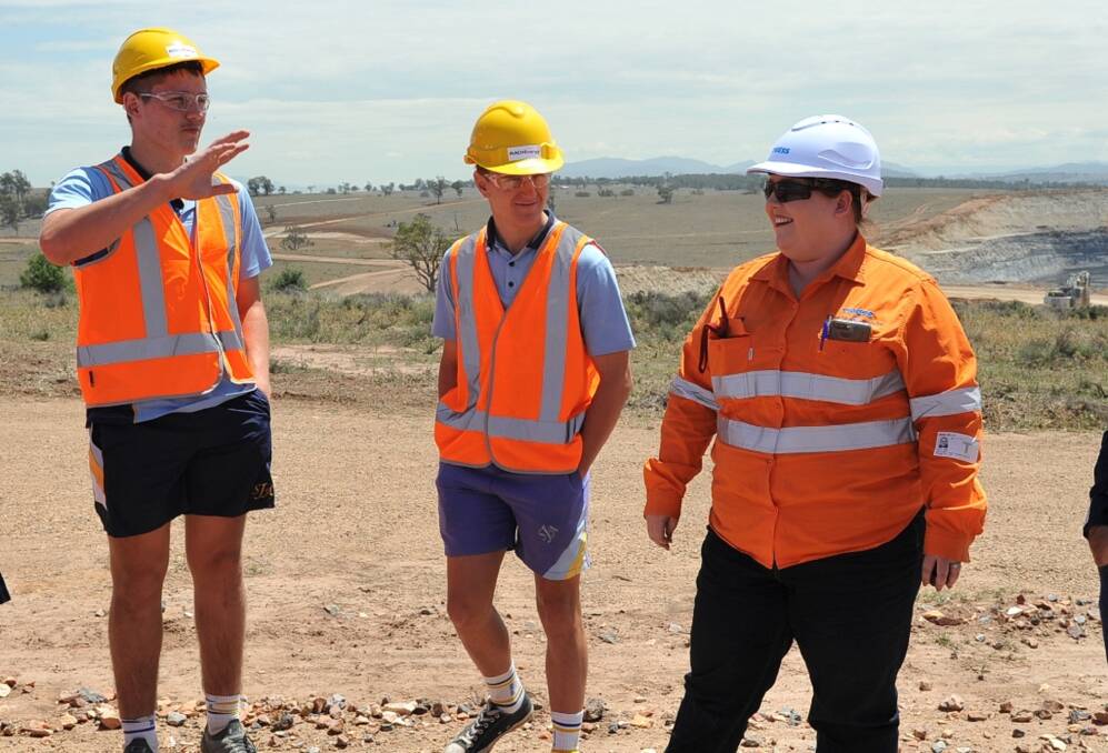 CUTTING THROUGH WITH SKILLS: Thiess coal quality geologist Sarah with local school students during the one of the Upper Hunter Mining Dialogue school tours to Mount Pleasant.