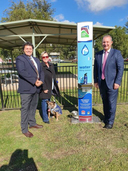 Opening the water pipeline to Murrurundi and the towns first water bottle refilling station today, Upper Hunter Shire Council Mayor Wayne Bedggood, his wife Michelle and dog Whiskey, with Upper Hunter MP Michael Johnsen. 