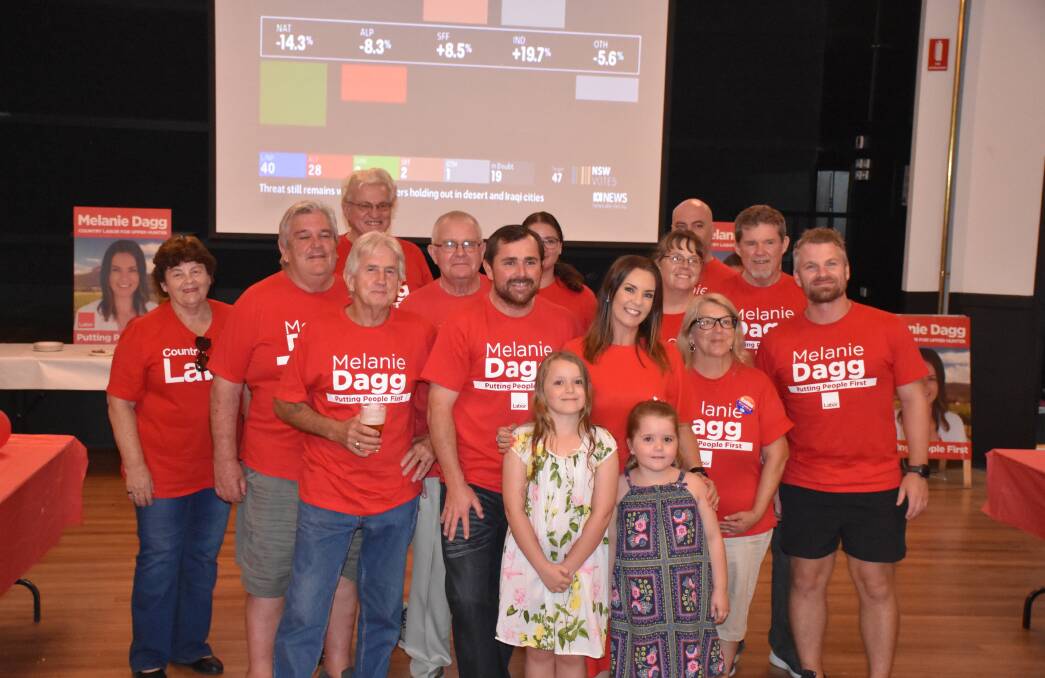 Melanie Dagg and her husband Josh and their daughters with their supporters