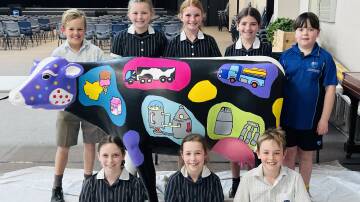 Australian Christian College students with their Picasso cow. Picture supplied