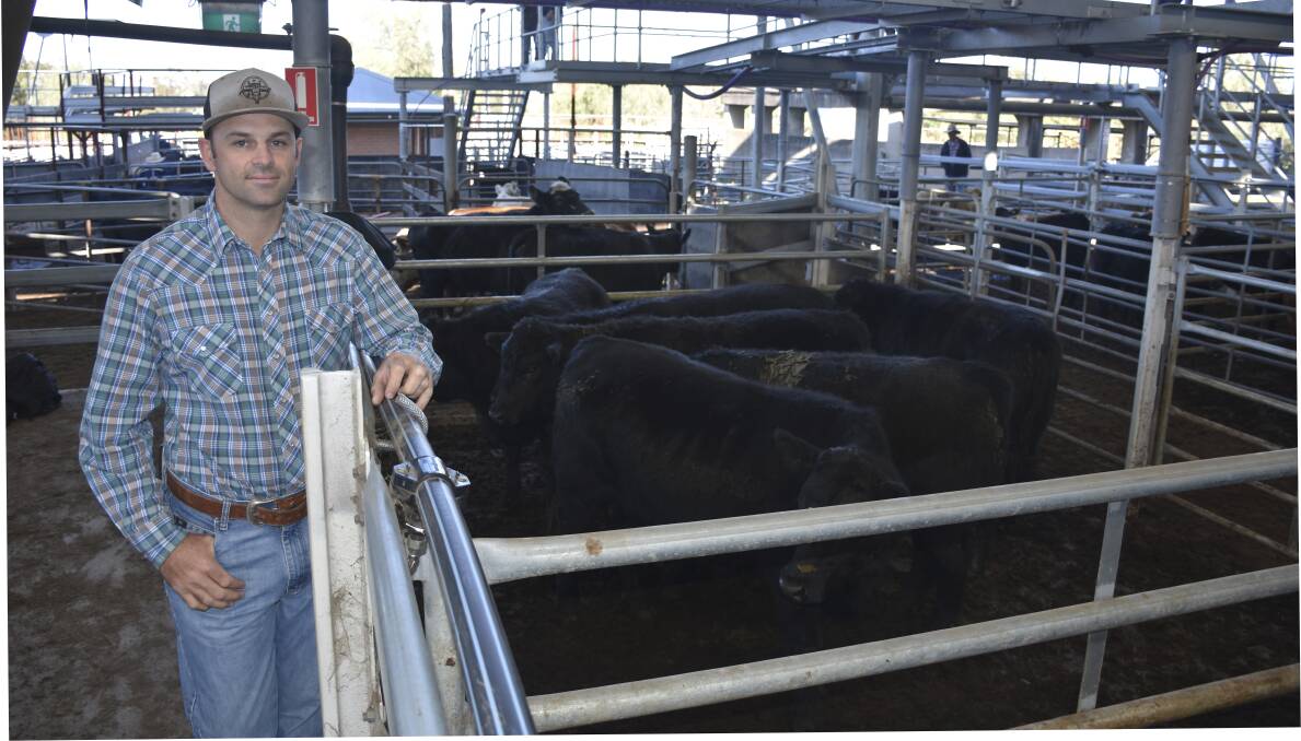 SUPPORT: E.C. Throsby buyer Mitch Russell with the steer his company bought at the charity auction.