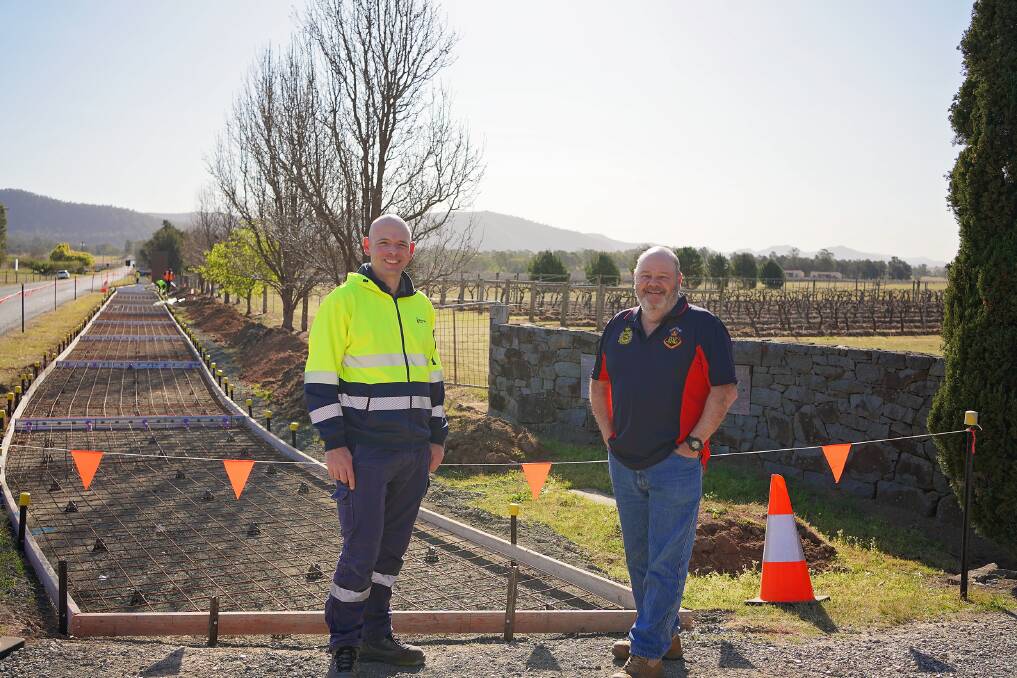 Councils Traffic Engineering Officer Paul Smith and Broke Residents Community Association Inc President Mick McCardle in front of stage two of the Broke Shared Pathway. Picture supplied