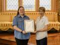 Grace Russell receiving her Queen's Guide Award from the NSW Governor Margaret Beazley. Picture supplied