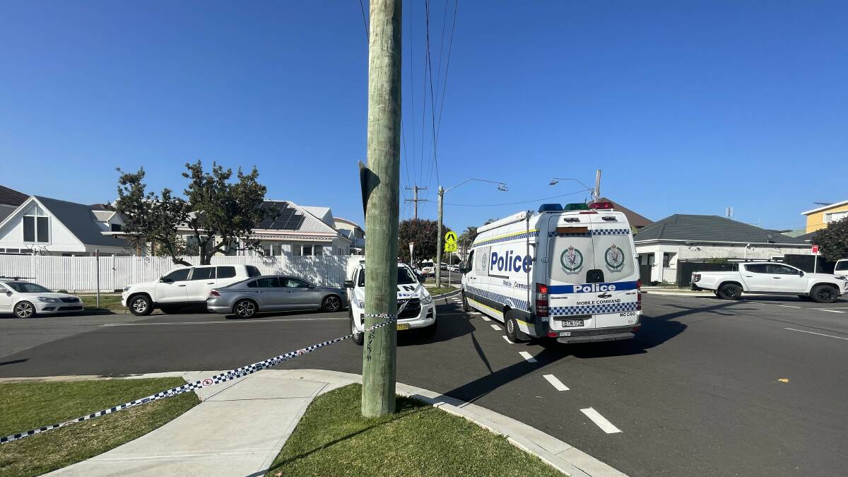 Police remained at the scene in Merewether on Tuesday. Picture by Max McKinney
