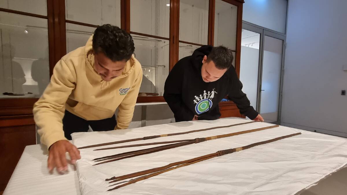 David Johnson, left, and Quaiden Williams, right, members of the Gweagal Clan of the Dharawal Nation inspecting the Kamay spears 2022. Picture Ray Ingrey