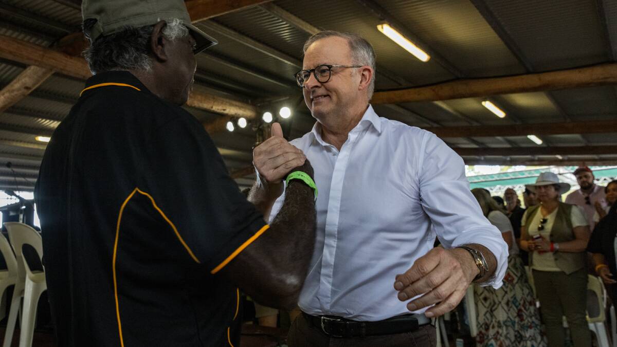 Anthony Albanese grasps the hand of Mr. Djawa Yunupingu during Garma Festival at the weekend. Picture Getty Images