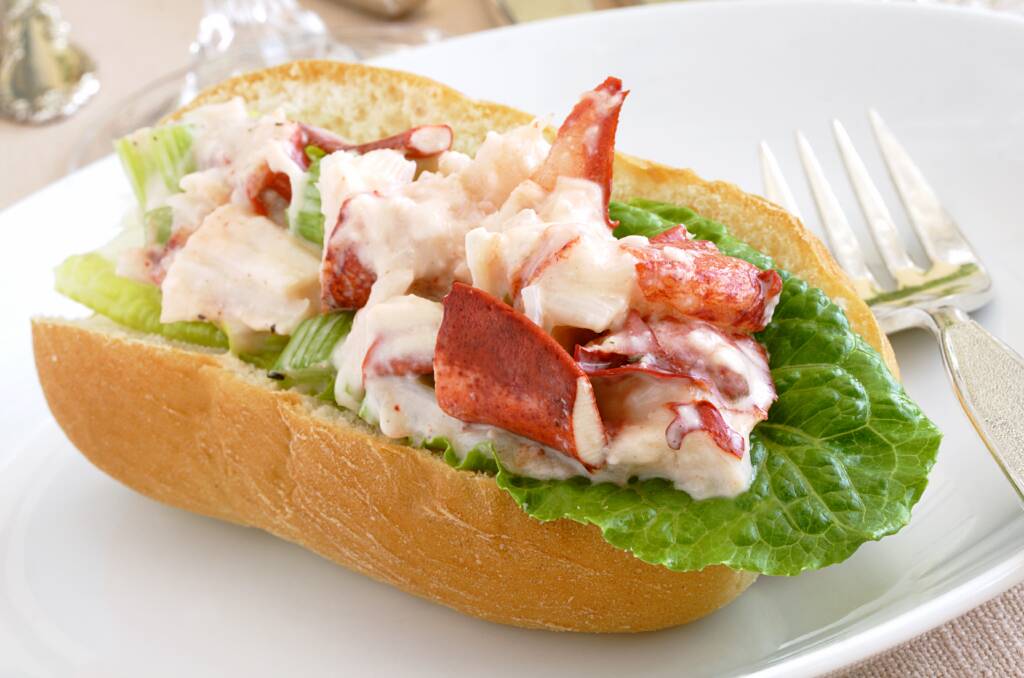 ON A ROLL: Lobsters are a good price this year, so spoil yourself with a lobster roll to go with a gin and tonic highball.
