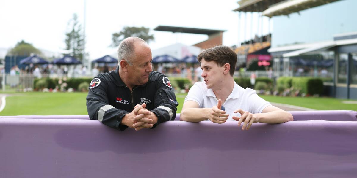 Westpac Rescue Helicopter first responder Glen Ramplin and injured jockey Lachlan Scorse catch up at Newcastle Racecourse on Saturday. Picture by Peter Lorimer