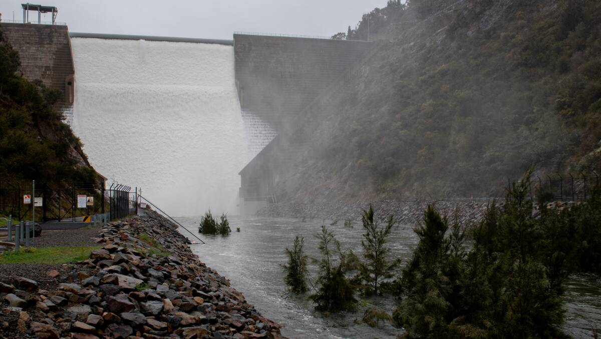Water flows over Cotter Dam in the ACT. Picture by Elesa Kurtz