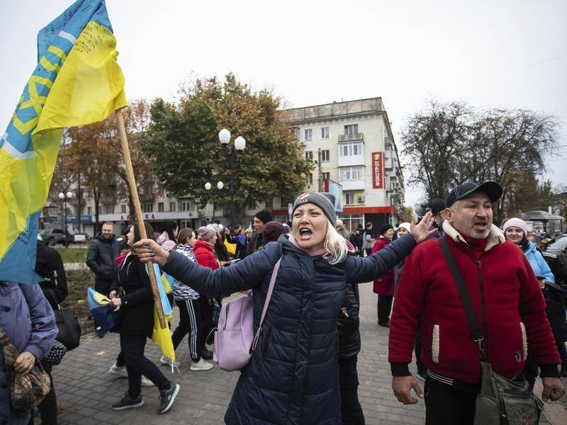 Jubilant Ukrainians have taken to the streets in Kherson to celebrate Russia's withdrawal. 