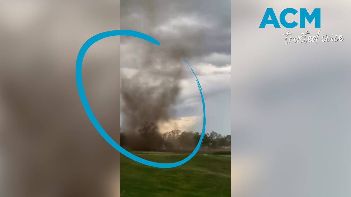 A mini tornado, or a 'gustnado' with the strength to lift tents and damage roofs, has been filmed over Katherine in the Northern Territory. Picture supplied.