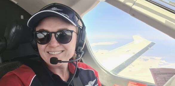 An in-flight happy Laura Koerbin, somewhere over Lake Gairdner, SA. Picture supplied