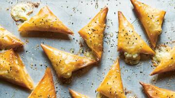 Filo triangles stuffed with feta. Picture by Saghar Setareh