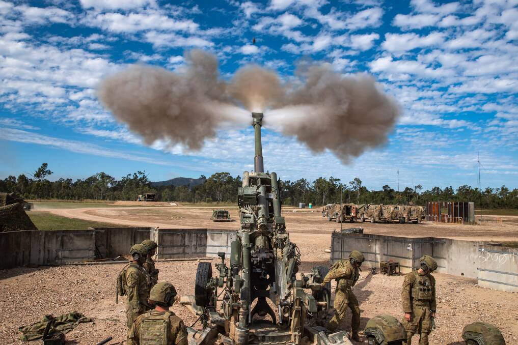 READY, AIM, FIRE: Australian Army Gunners from the 105th Battery of the 1st Regiment, Royal Australian Artillery, fire a 155mm SMArt anti-armour round from a M777 155mm Howitzer