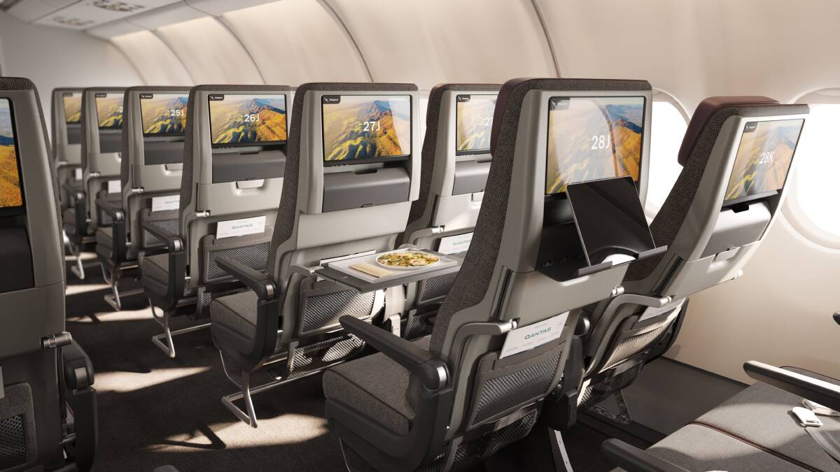 Qantas A330 cabin upgrade showing larger entertainment screens in economy class. Qantas A330 cabin upgrade showing larger entertainment screens in economy class.