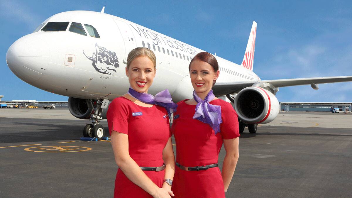 Virgin Australia staff with one of the carrier's Airbuses. Virgin Australia staff with one of the carrier's Airbuses.