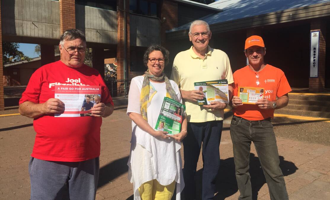 HELPING OUT: Roy Johnson, Virginia Thomas, former state member George Souris and Christian Democratic Party's Richard Stretton at Singleton High School on Saturday.