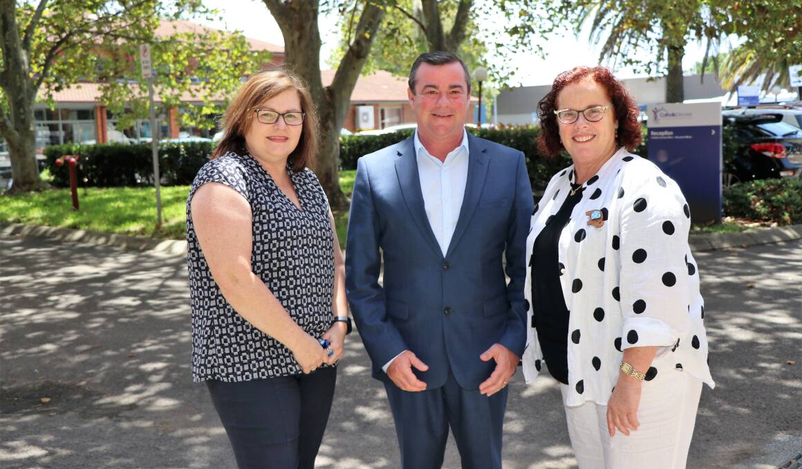 Parent Elizabeth Stokes with the Director of CatholicCare Gary Christensen and principal of St Josephs Primary School Denman Helen Whale
