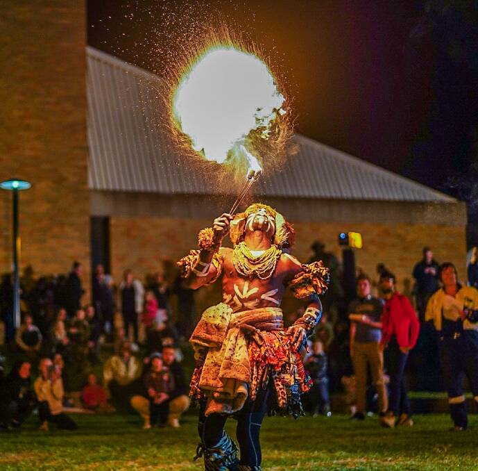 FIRED UP: A dancer from Rhythm Connect lights up the night and the crowd at Singleton Firelight. Pic: MORE LIFE FILMS