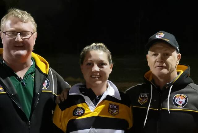Group 21 president Simon Walmsley and coach Mick Schmiedel (right) with Greater Northern Tigers Jessyca Morgan, who picked up the players player and representative player awards.
