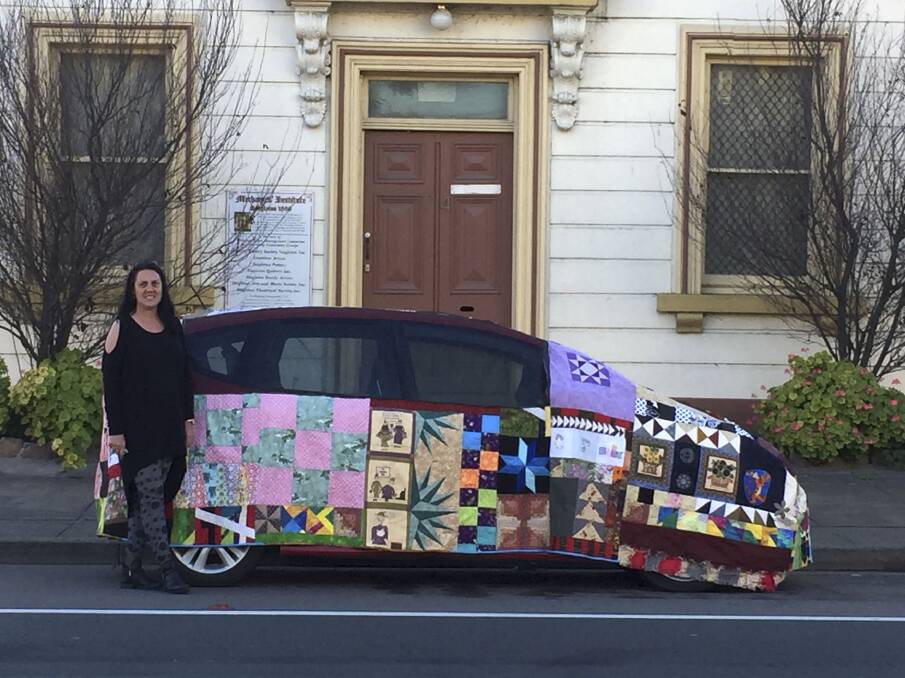 COVERED IN STYLE: Singleton Quilters vice-president Heather Anderson with the quilt she made for her car, which will be showcased later this week.  