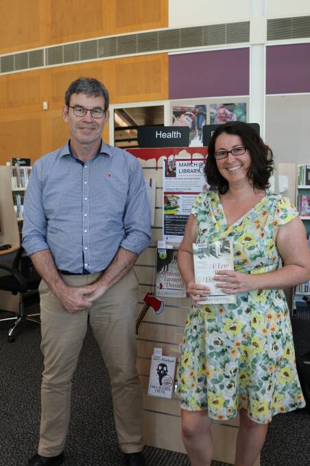 FANS: Team leader library programs Rob Stewart with library marketing and systems officer Samantha Watters.