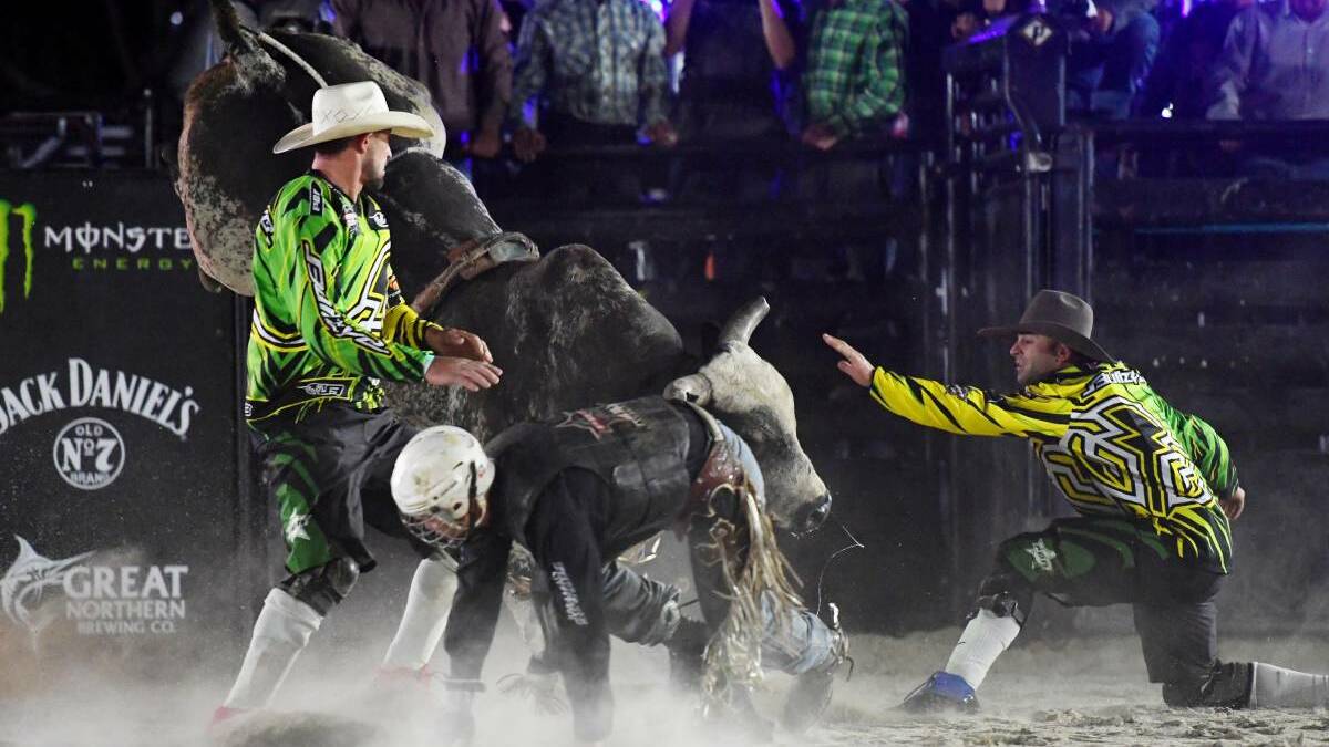 Protection athletes Mitch Russell and Geoff Hall in action during the Professional Bull Riders Monster Energy Tour Iron Cowboy event at Tamworths AELEC Arena.